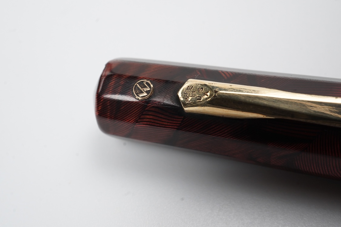 A Wahl Eversharp lever fill 'Doric' fountain pen in garnet colour with gold filled trim